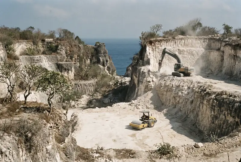 Earthworks machines cutting building pads near Dreamland beach in Pecatu Bali