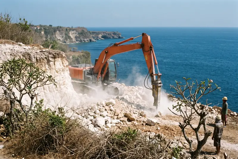 Hydraulic breaker excavating limestone bedrock for a villa pool in Uluwatu Bali